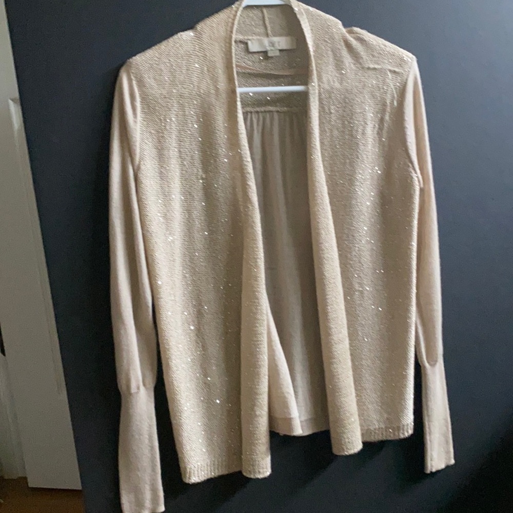 Cream Loft sweater with subtle sparkle.